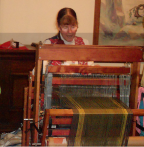 Photo of Jane Flanagan at her loom.