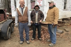 Rodney-Laughton-left-with-Josh-Steve-Merry-after-move-of-schoolhouse-to-new-foundation-2019-11-20-Photo-by-Karlene-Osborne