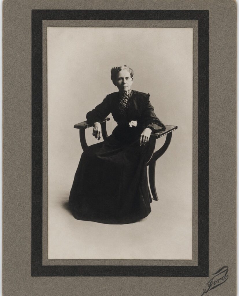 Photo of A. J. Poland, sitting in a chair, circa 1889.