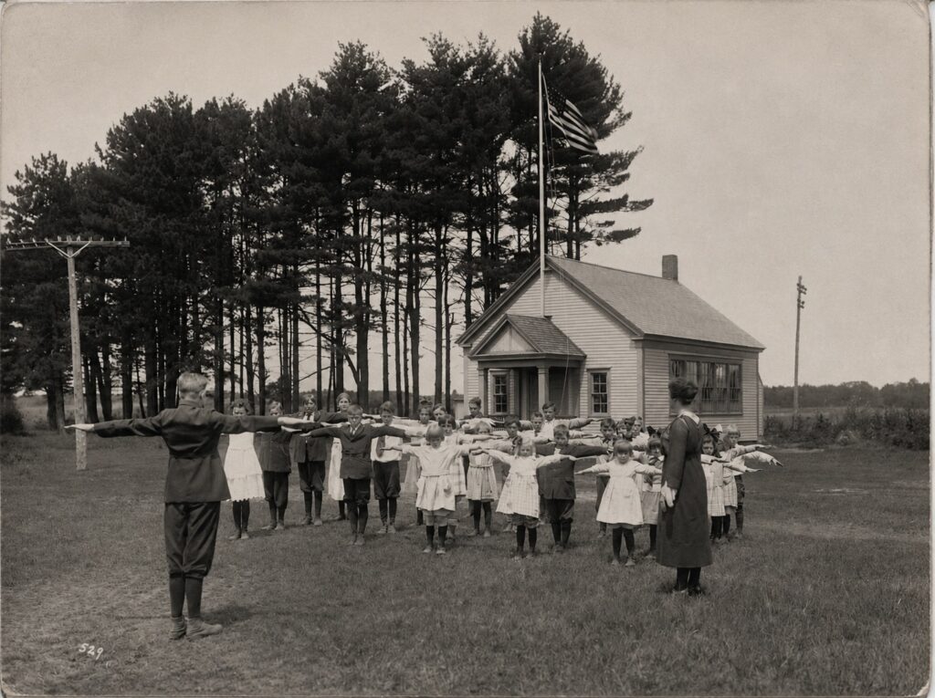 Photo of children with arms outstreched at North Scarborough School, 1922